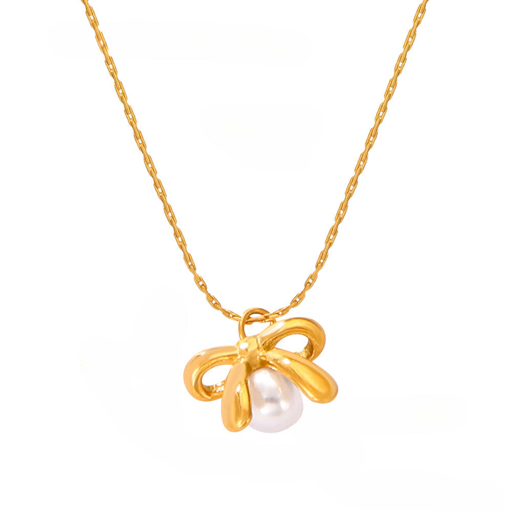 Minimalist Gold Bow With A Pearl Necklace