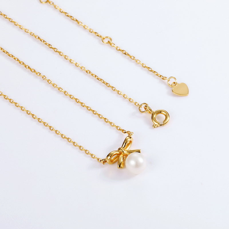 Bow Tie Necklace With Pearl Pendant